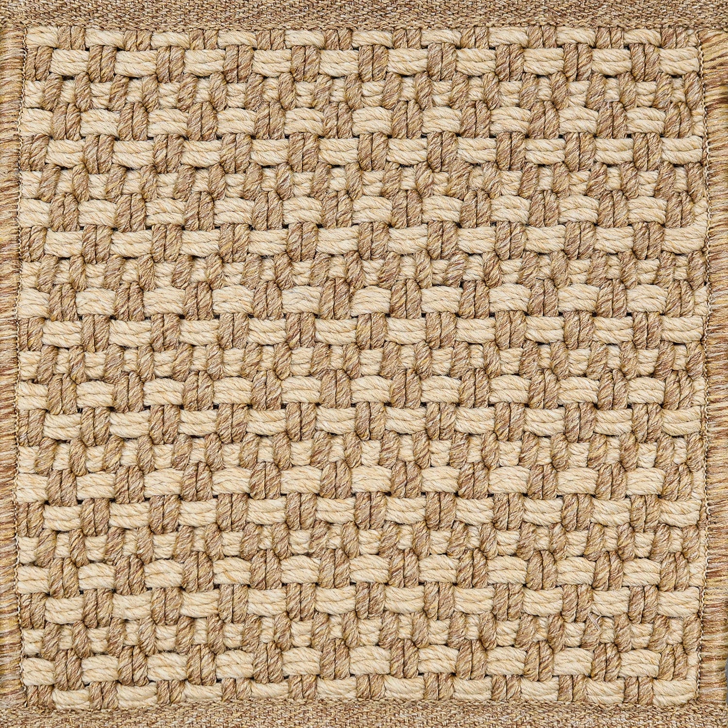 Textured woven outdoor carpet a basketweave design in tan.