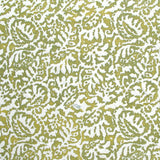 Fabric in a botanical paisley print in white on a mustard field.