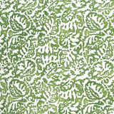 Fabric in a botanical paisley print in white on a green field.