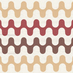 Detail of wallpaper in a playful curving stripe print in shades of yellow, red and orange on a white field.