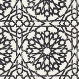 Detail of wallpaper in a small-scale lattice print in black on a cream field.