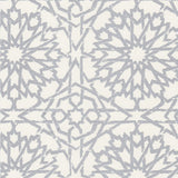 Detail of wallpaper in a small-scale lattice print in metallic gray on a white field.