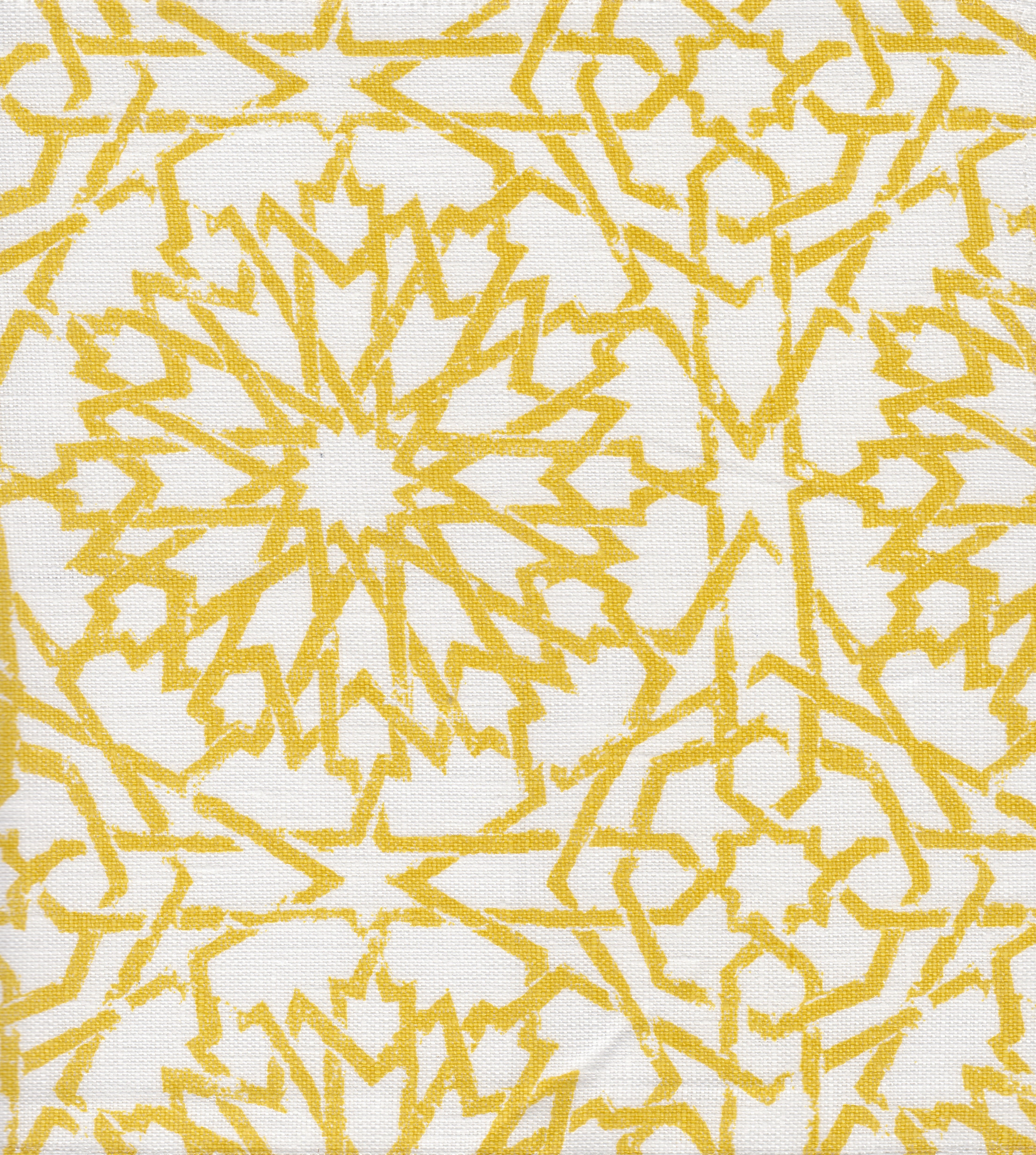 Detail of fabric in a small-scale lattice print in yellow on a white field.