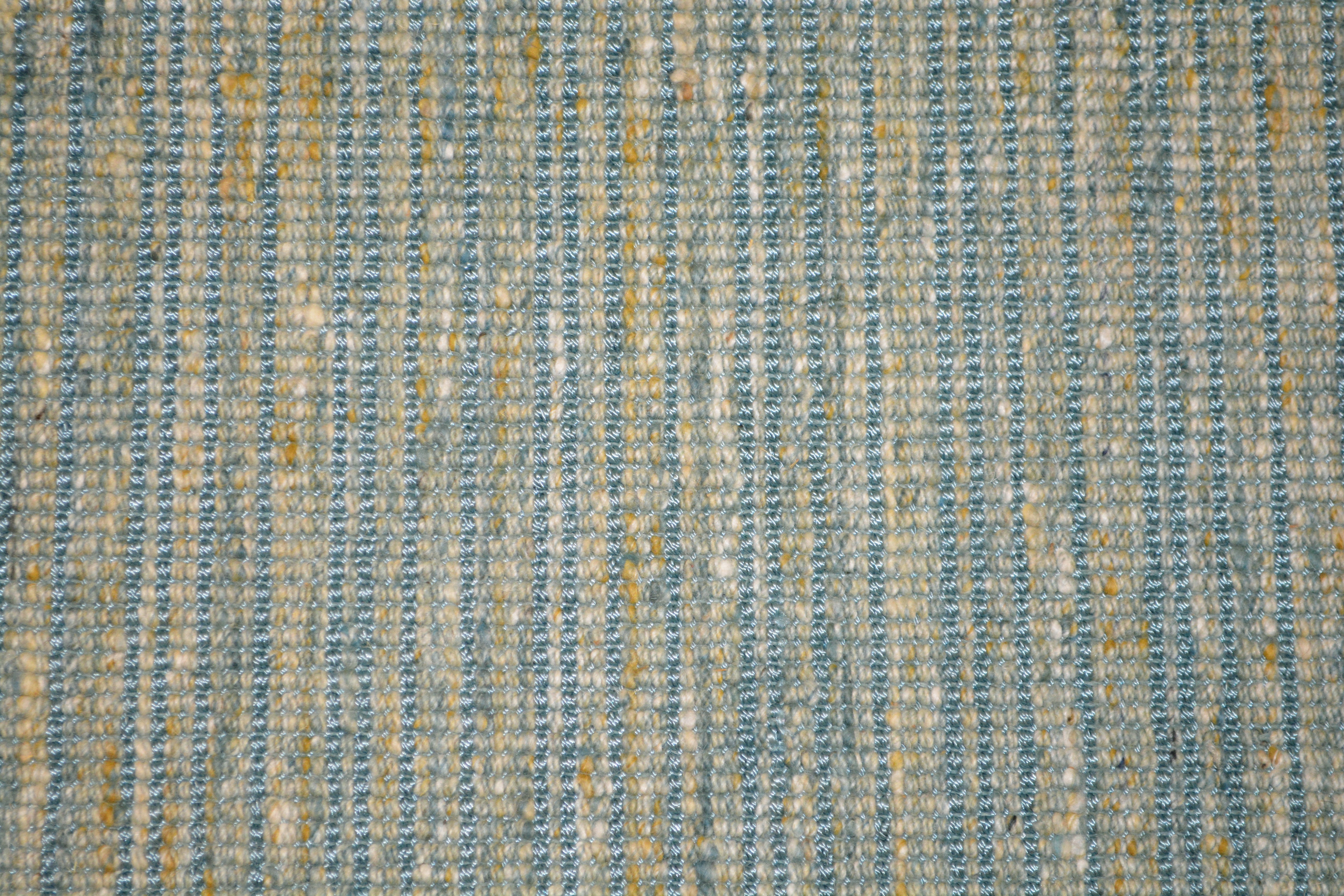 Textural broadloom carpet in blue.