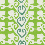 Detail of fabric in a minimalist botanical stripe in green and blue on a white field.