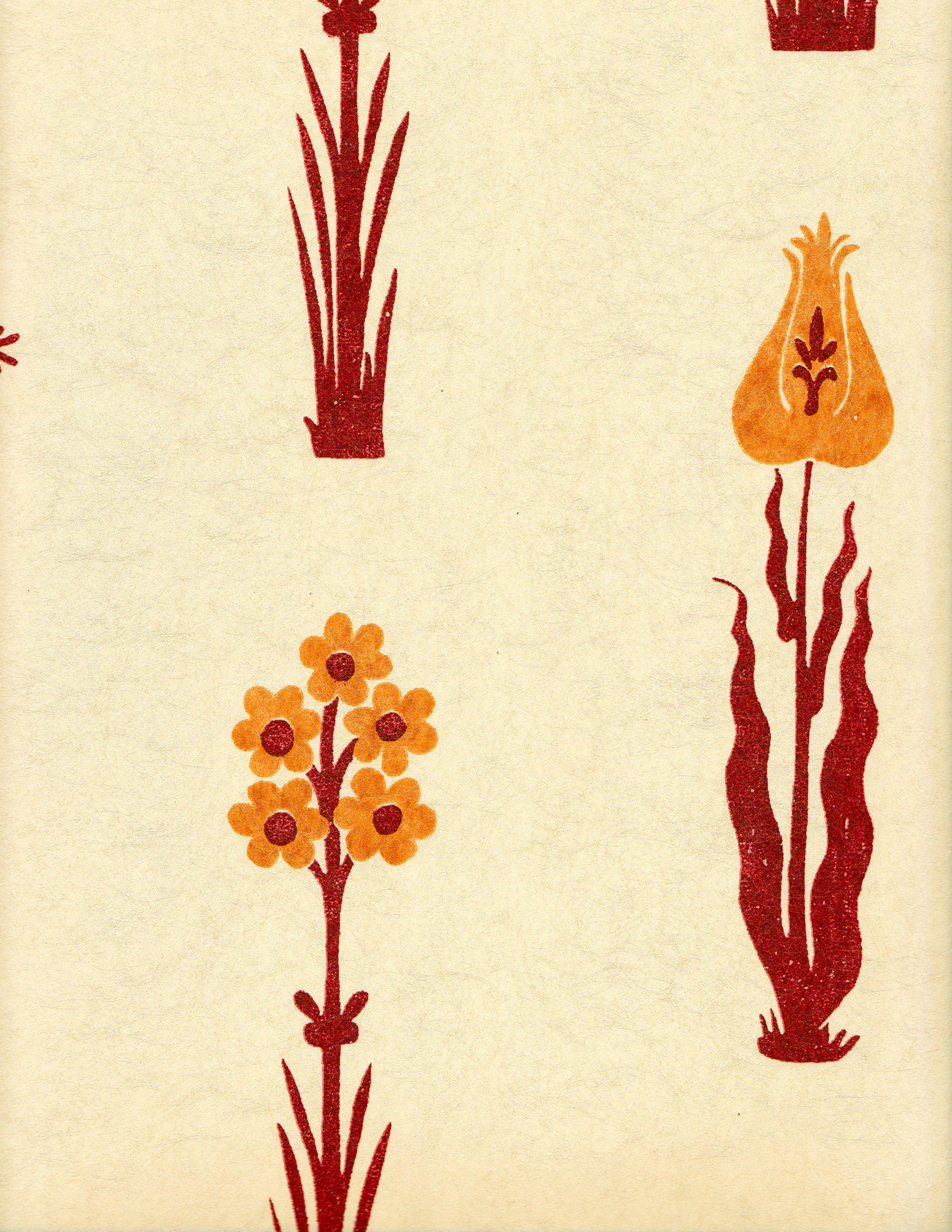 Detail of wallpaper in a playful floral print in red and orange on a cream field.