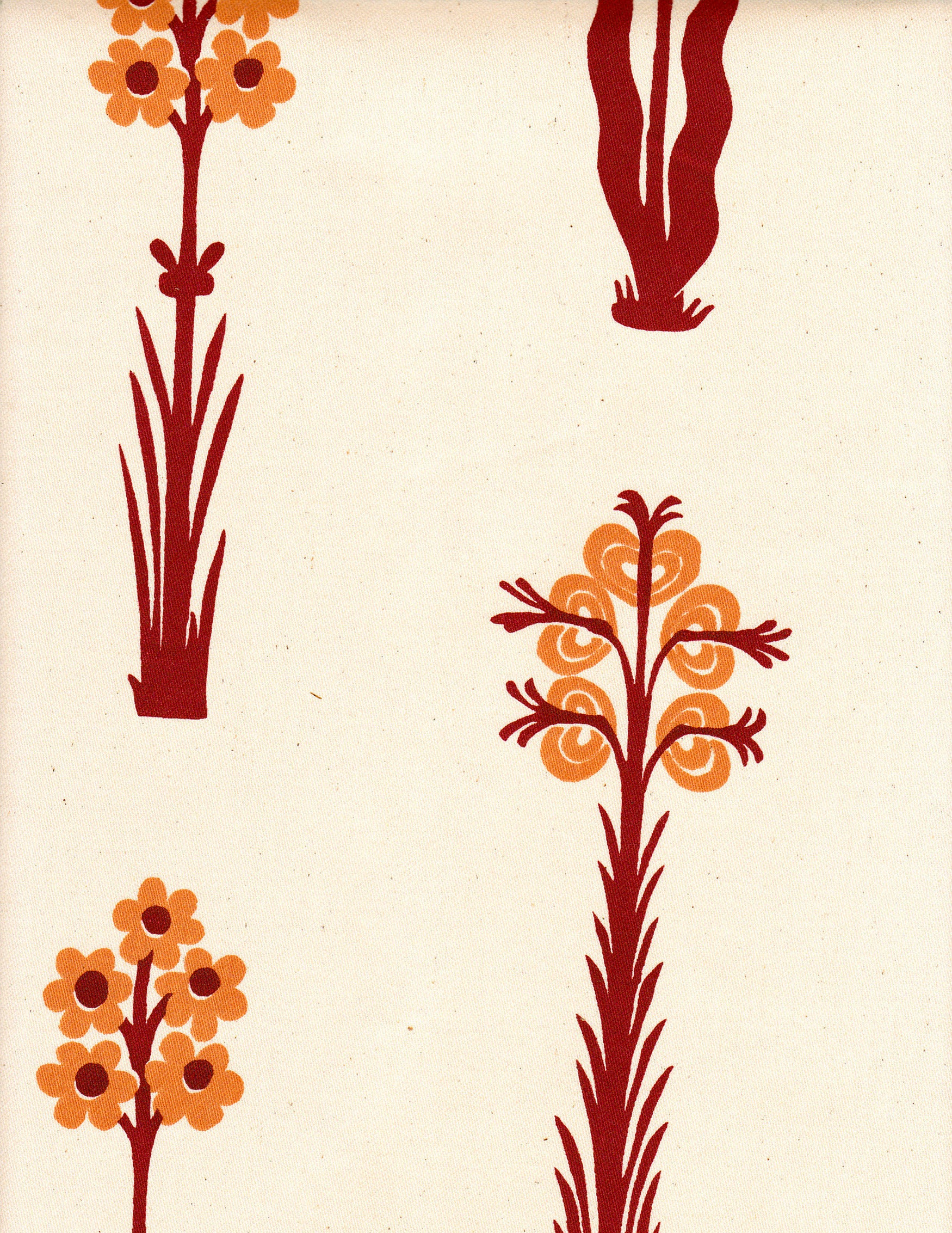 Detail of fabric in a playful floral print in red and orange on a cream field.