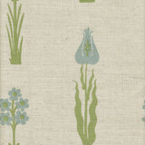 Detail of fabric in a playful floral print in blue and green on a cream field.