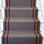 Striped flatweave runner in grey taupe and red on white staircase