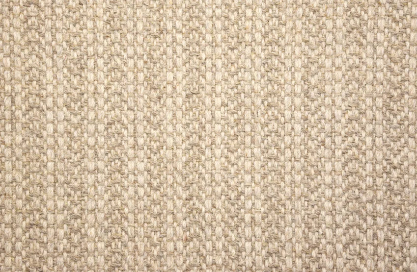 Broadloom carpet swatch in a herringbone pattern in a tan design