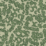 Wallpaper detail in a painterly botanical lace pattern in tonal shades of forest green.