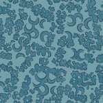 Wallpaper detail in a painterly botanical lace pattern in tonal shades of marine blue.