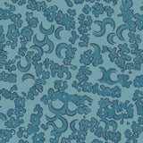 Wallpaper detail in a painterly botanical lace pattern in tonal shades of marine blue.