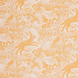 Detail of wallpaper in a playful rabbit and bird print in white on a yellow field.