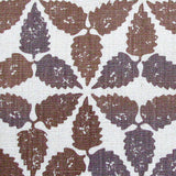 Fabric in a gridded floral print in brown and gray on a white field.