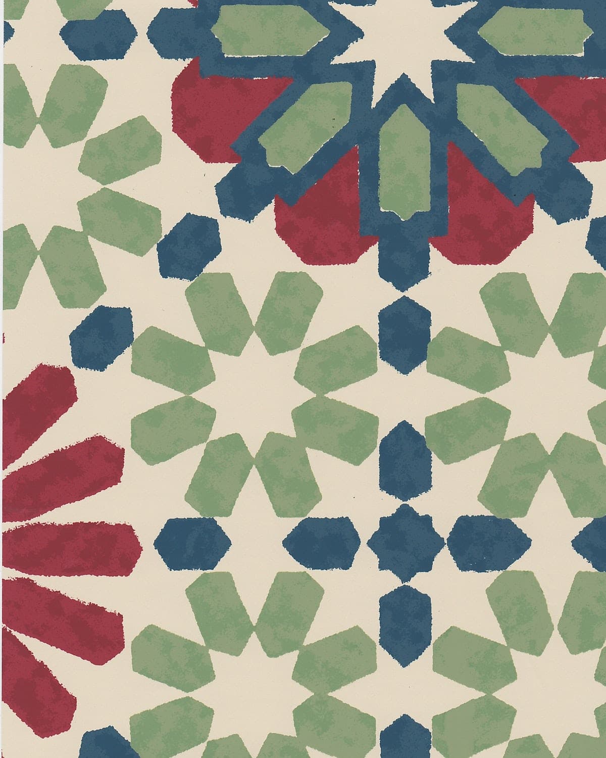 Detail of wallpaper in a geometric lattice print in shades of red, blue and green on a cream field.