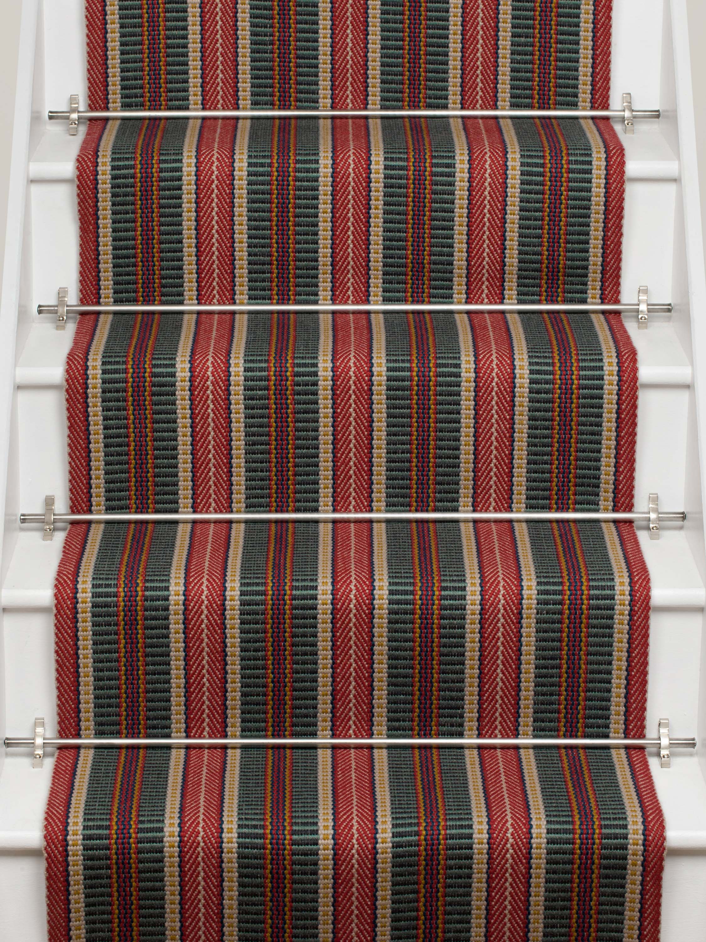 Striped flatweave runner in red and black on white staircase