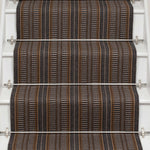 Striped flatweave runner in brown 
 mustard and black on white staircase