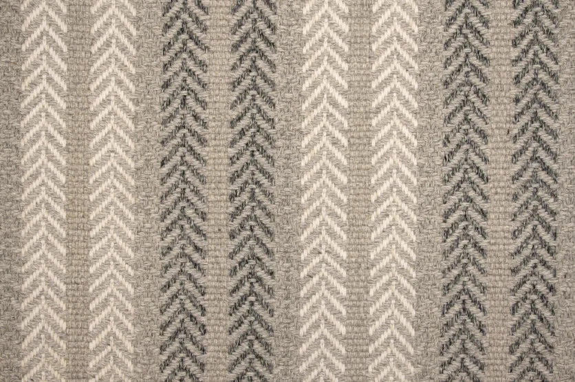 Broadloom carpet swatch in a herringbone pattern in a cream dark grey design