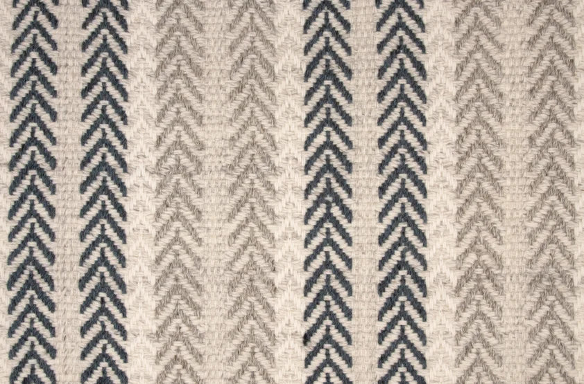 Broadloom carpet swatch in a herringbone pattern in a cream blue grey design