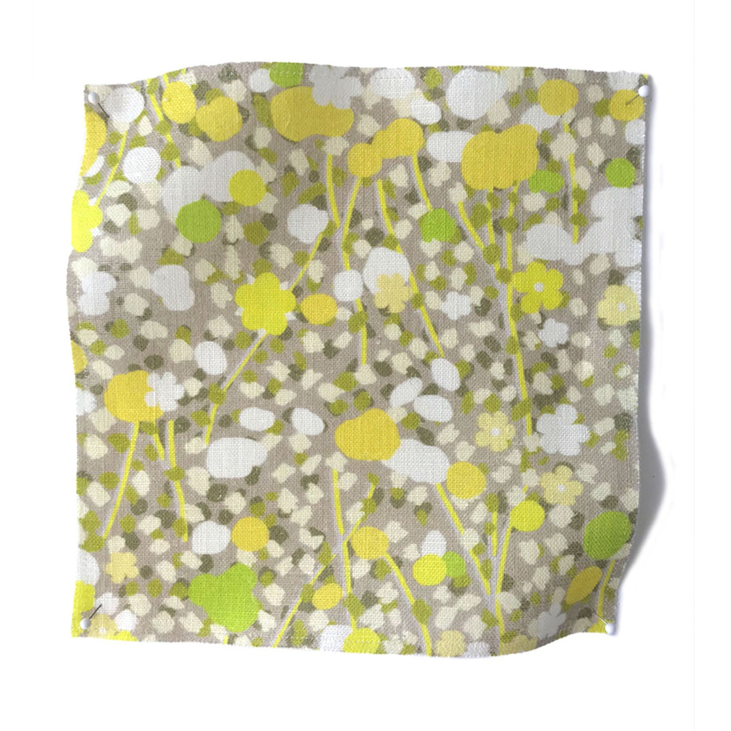Square fabric swatch in a dense botanical print in shades of green, yellow and white.