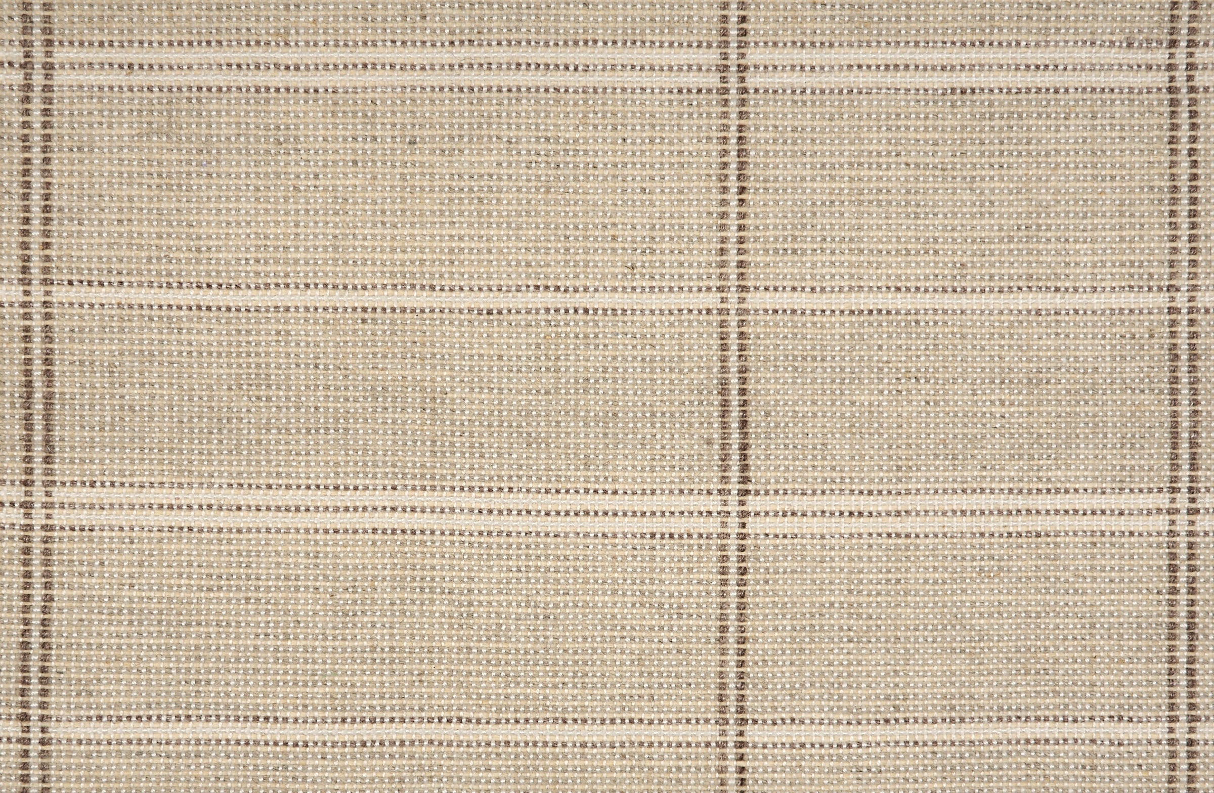 Broadloom carpet in large scale plaid in shades of taupe and brown.