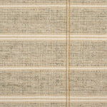 Broadloom carpet in large scale plaid in shades of tan and taupe.