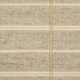 Broadloom carpet in large scale plaid in shades of tan and taupe.