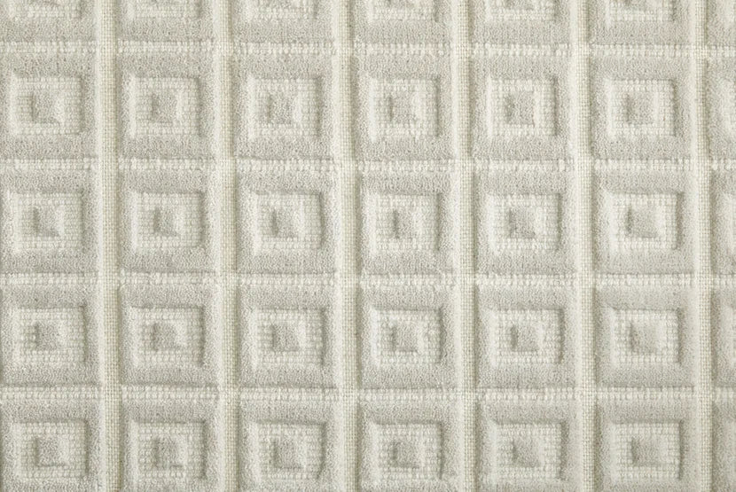 Broadloom carpet swatch in a geometric pattern in a white design