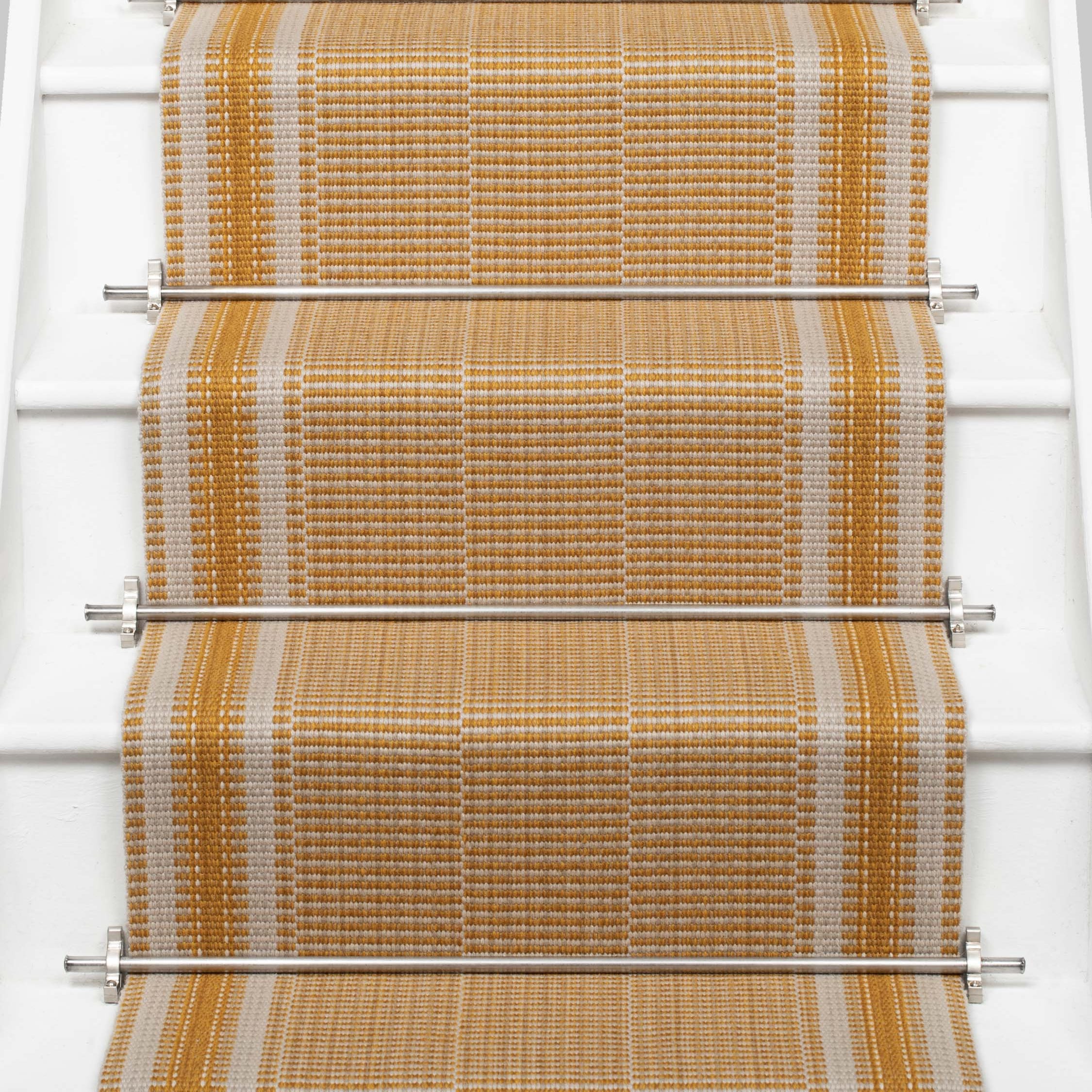 Striped flatweave runner in orange on white staircase 