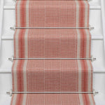 Striped flatweave runner in red on white staircase