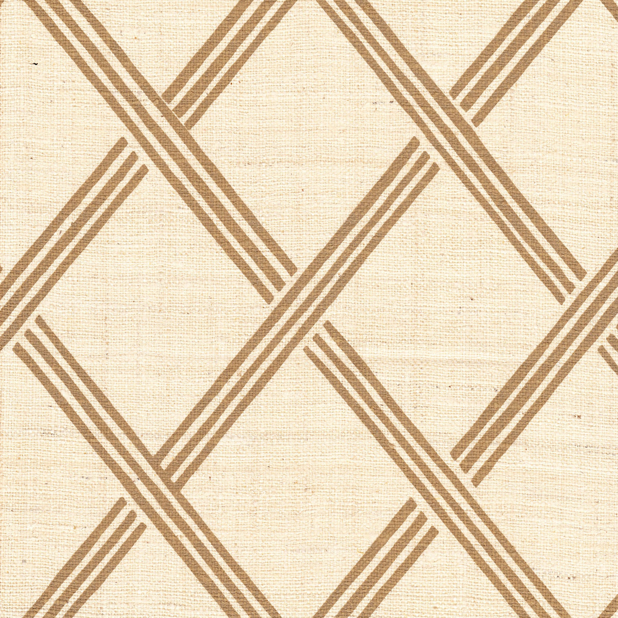 Detail of fabric in a diamond lattice print in brown on a cream field.