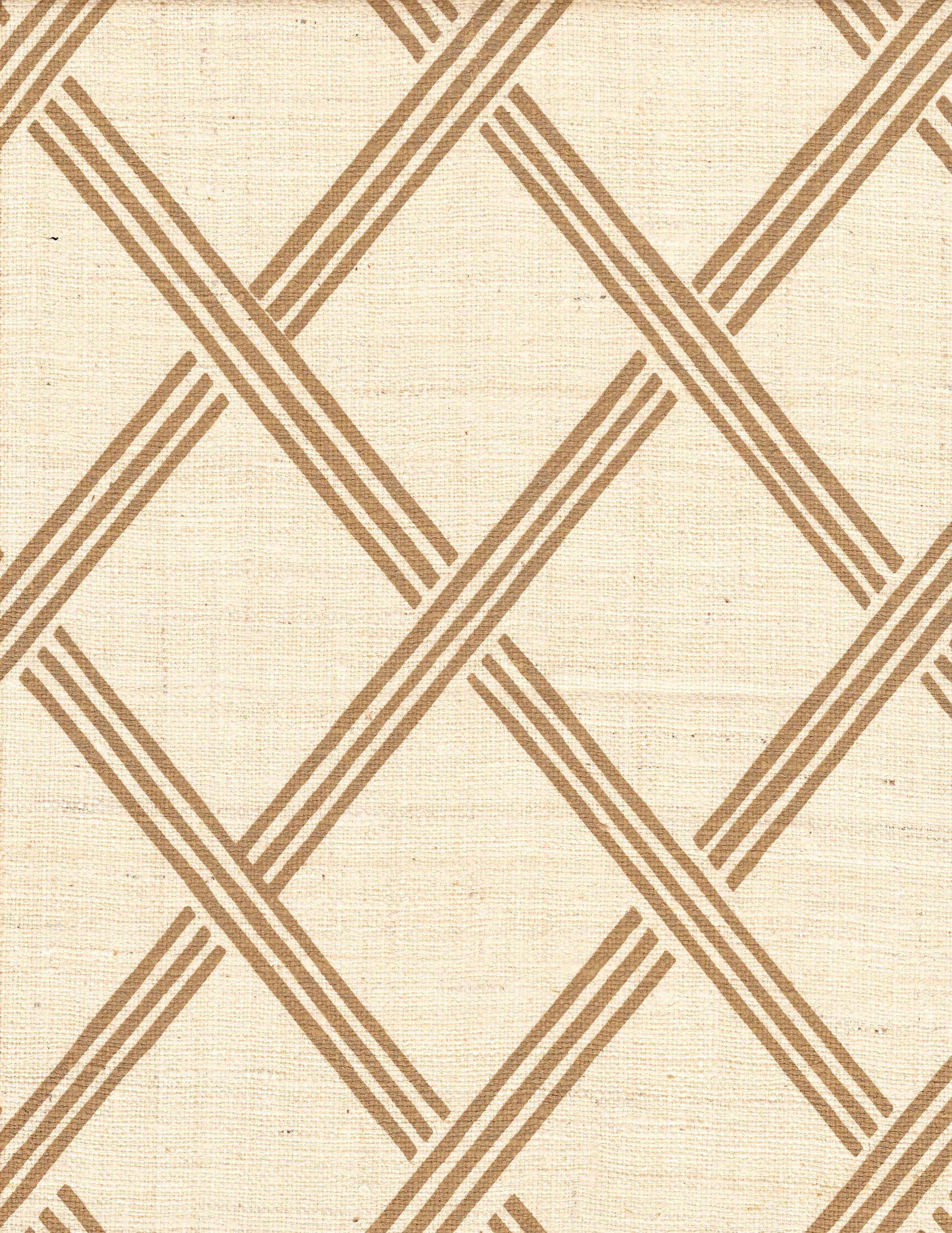 Detail of fabric in a diamond lattice print in brown on a cream field.