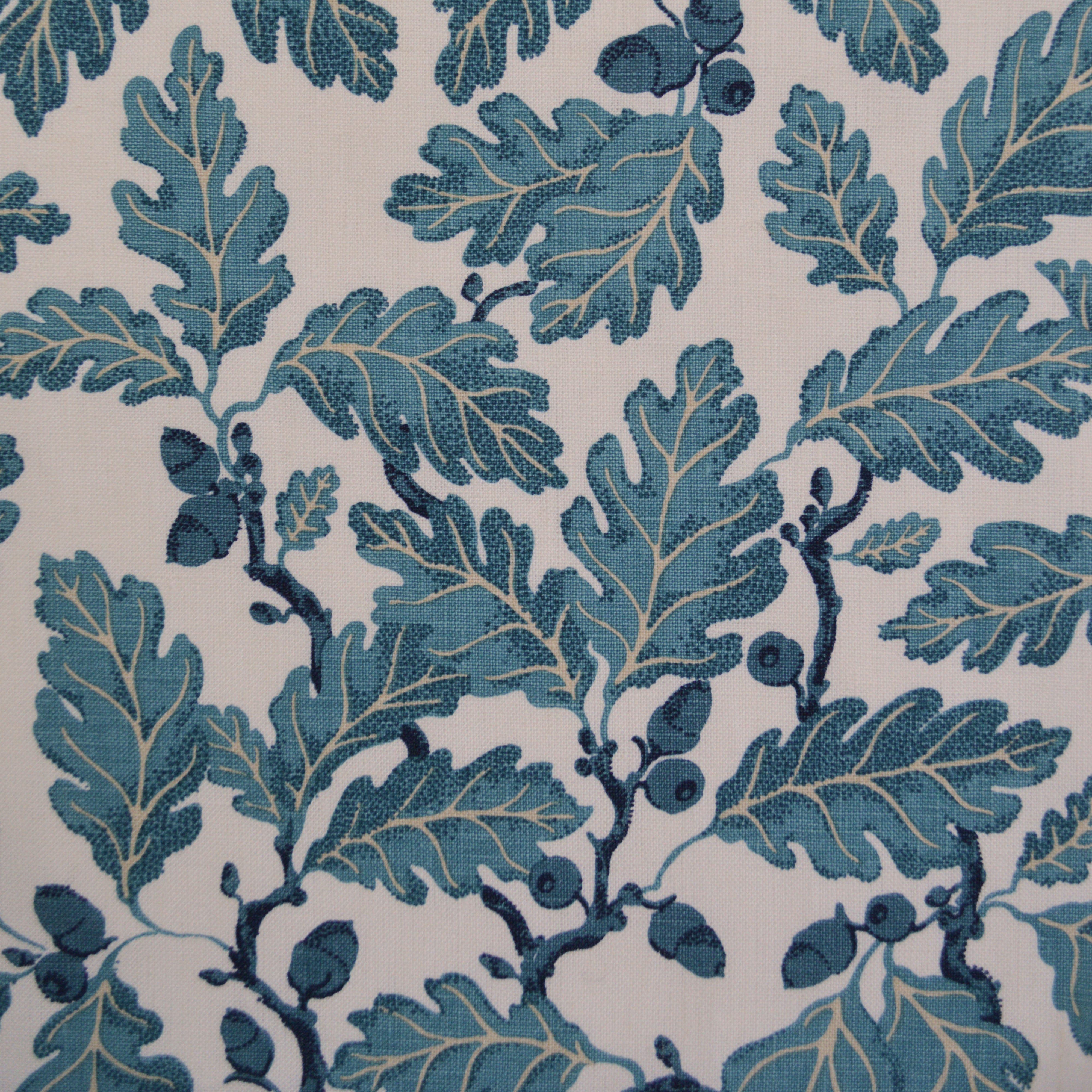 Pattern of blue leaves and branches on a white background