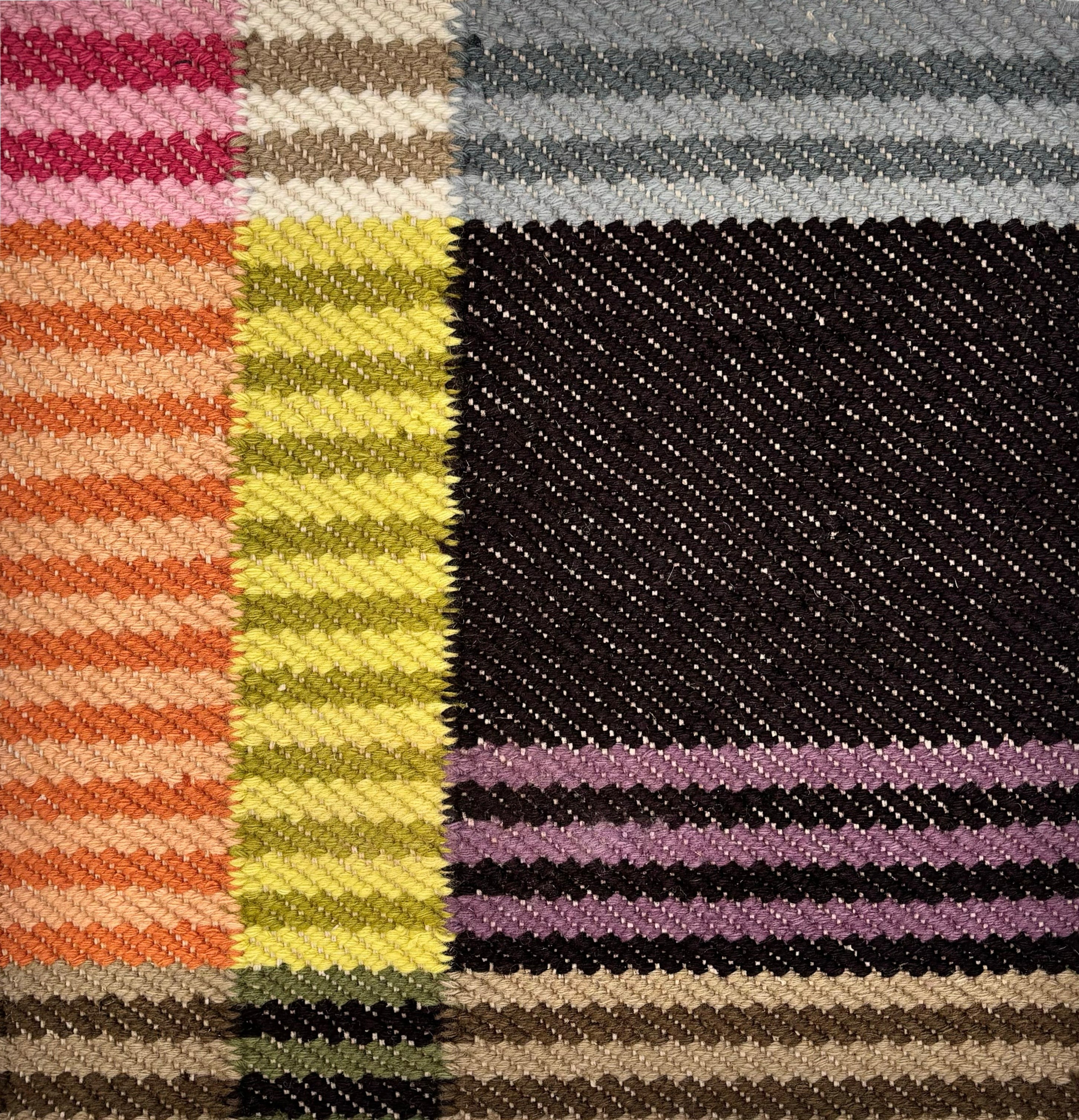 Detail of a flatwoven rug in a graphic broken stripe pattern in bright colors- orange, lime, pink, black, grey brown and green.