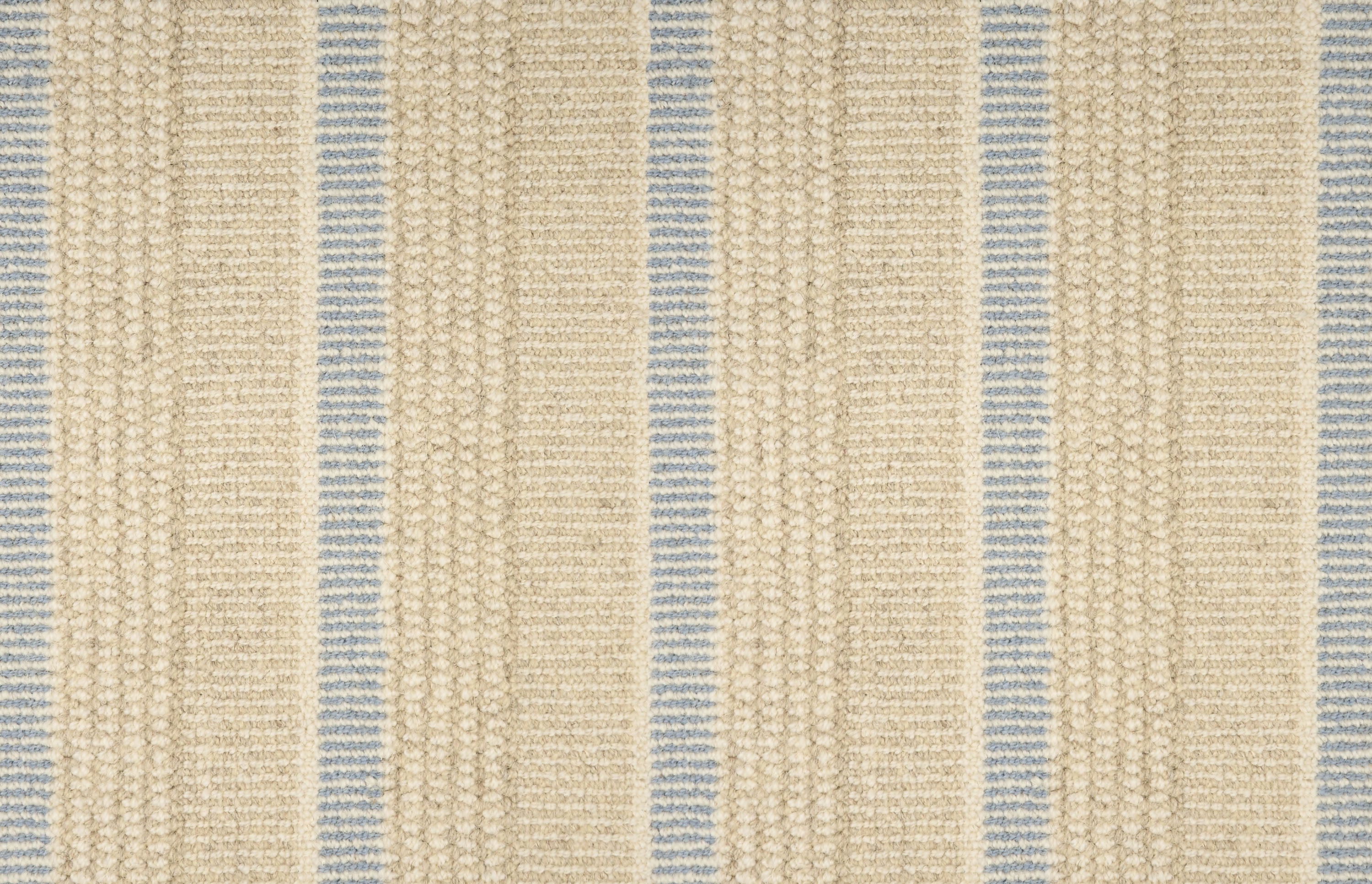 Textured broadloom carpet in beige with stripes in light blue.