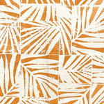 Detail of fabric in a botanical grid print in orange on a white field.