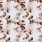 Detail of fabric in an abstract floral print in pink, coral and brown on a white field.