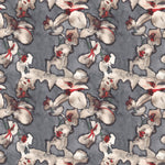 Detail of fabric in an abstract floral print in red, cream and gray on a dark gray field.