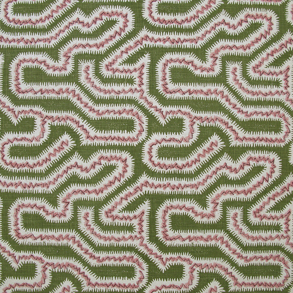 Detail of fabric in a dense meandering print in white, pink and purple on a green field.