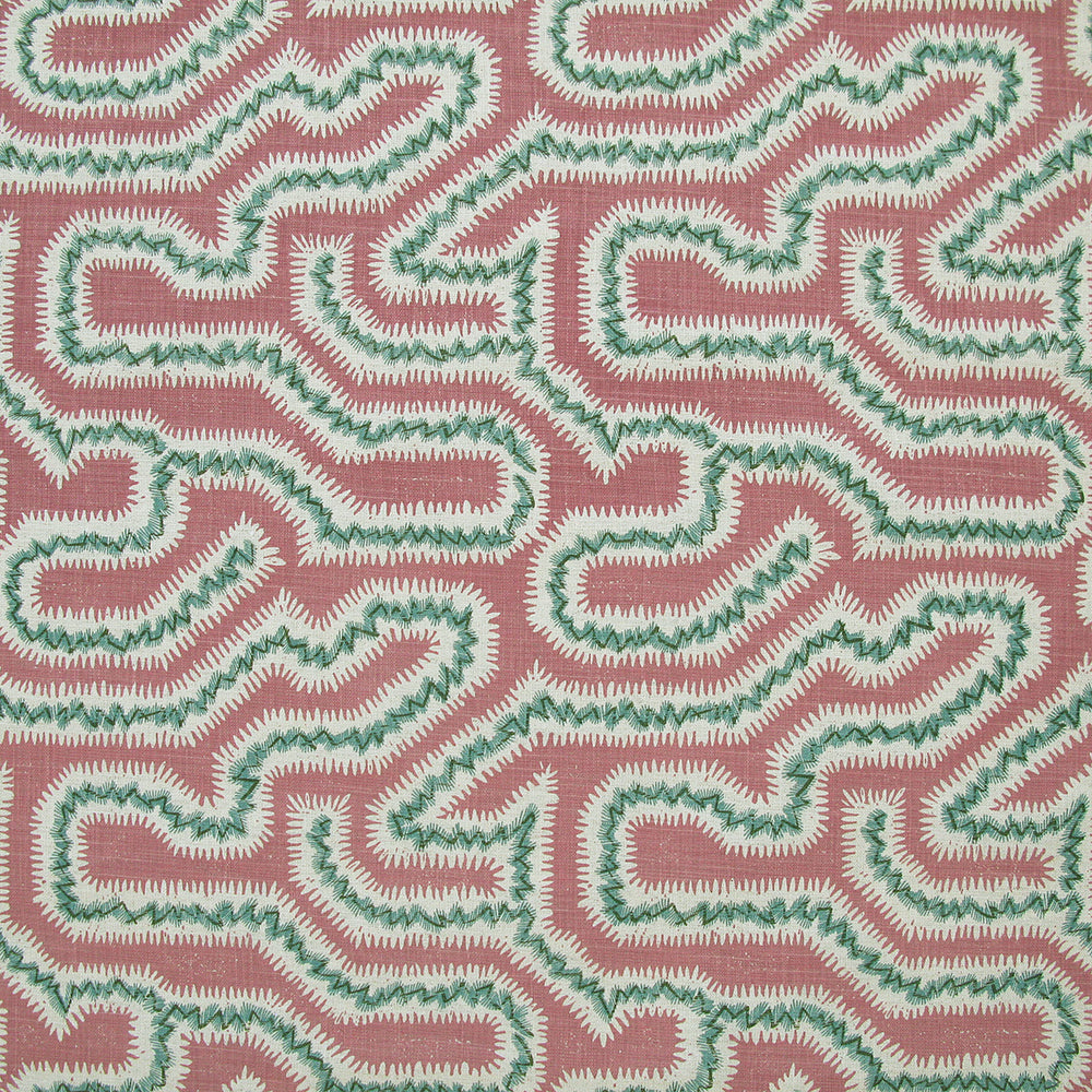 Detail of fabric in a dense meandering print in white and green on a pink field.