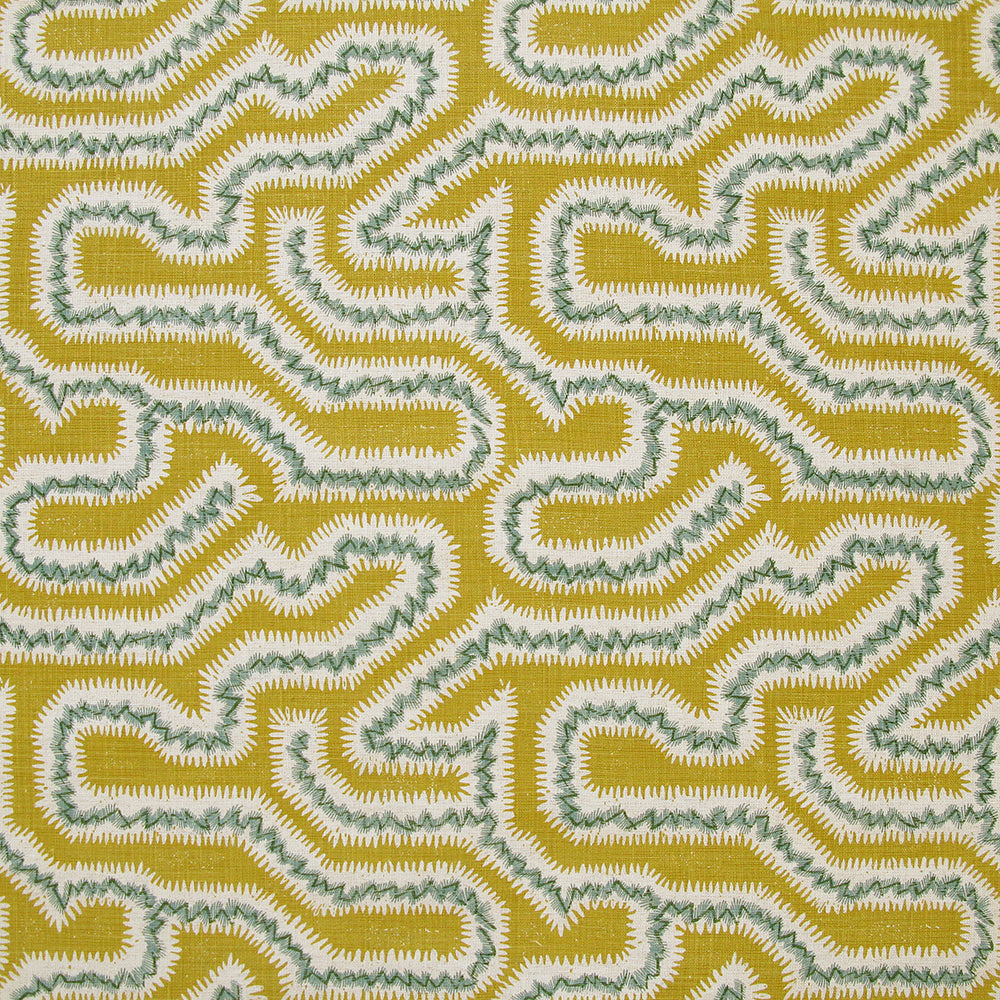 Detail of fabric in a dense meandering print in white, turquoise and gray on a mustard field.