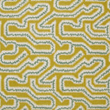 Detail of fabric in a dense meandering print in white, turquoise and gray on a mustard field.