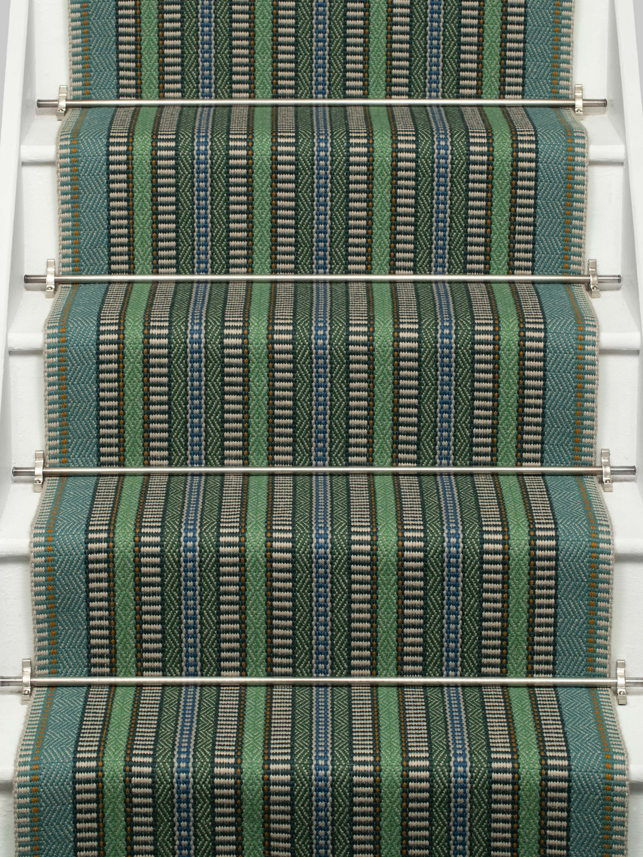 Striped flatweave runner in green blue black on white staircase