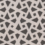 Detail of fabric in a geometric lattice print in charcoal on a greige field.