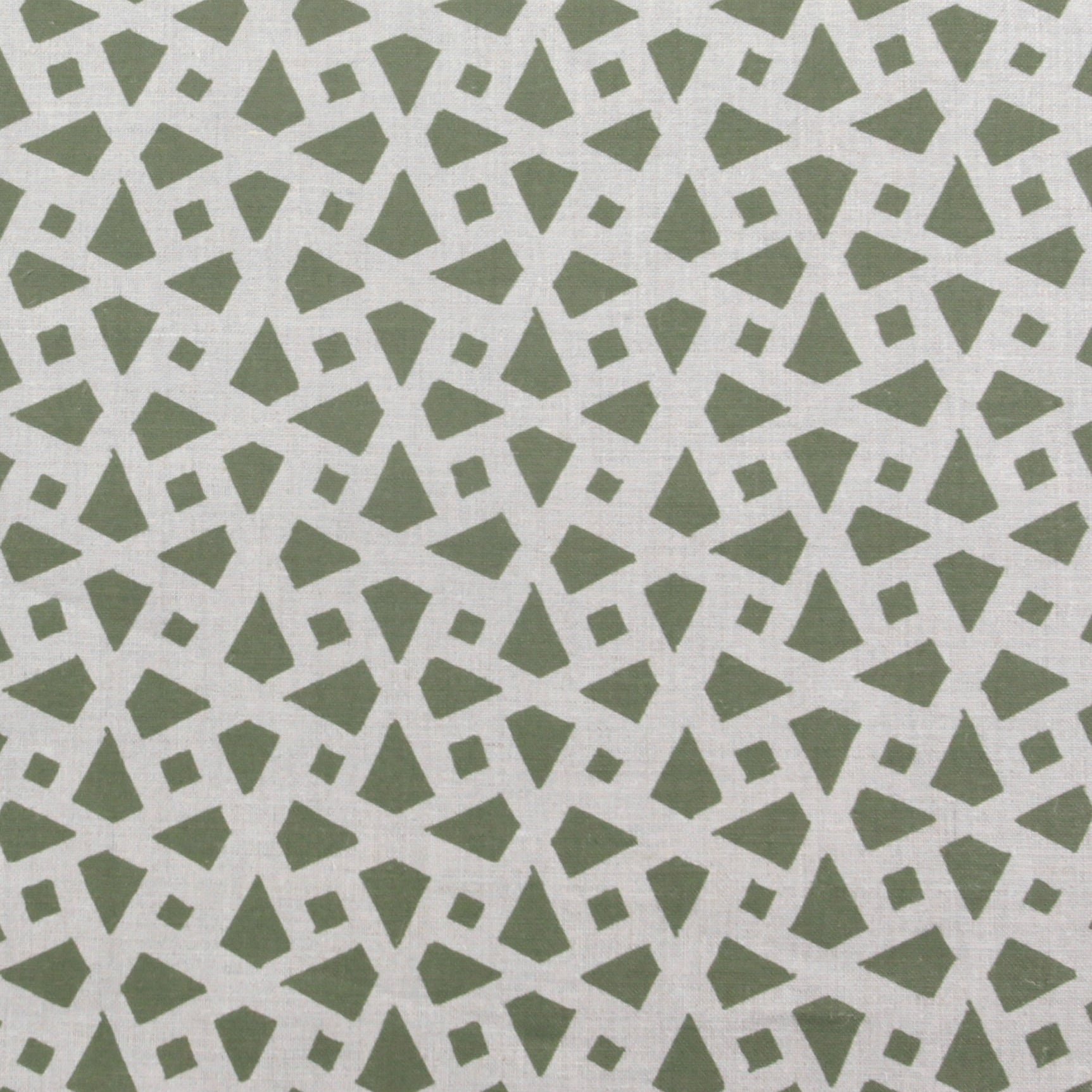 Detail of fabric in a geometric lattice print in sage on a greige field.