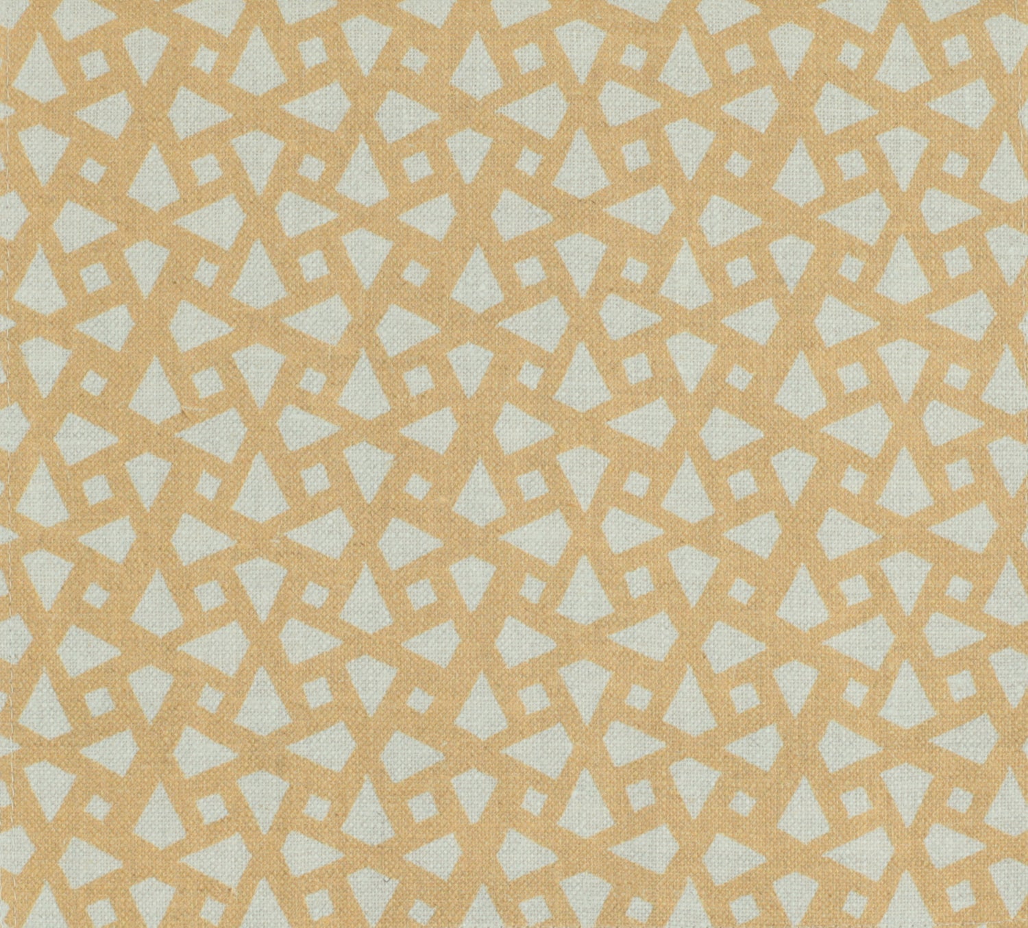 Detail of fabric in a geometric lattice print in gold on a cream field.