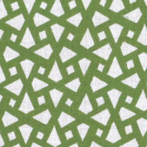 Detail of fabric in a geometric lattice print in green on a cream field.