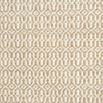 A rug with a woven overall pattern in tan and ivory.