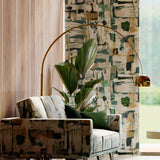 A modernist living room with an accent wall and sofa both covered in the same abstract layered paint blotch print.